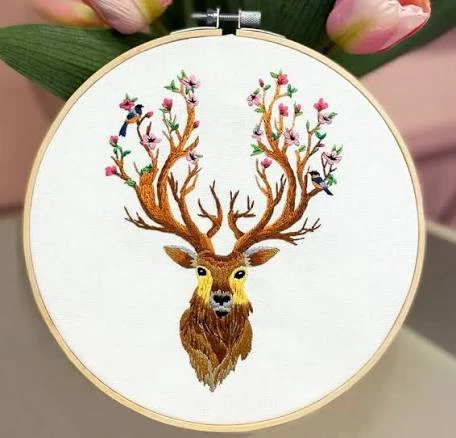 Stag with blossoming antlers — long-and-short shading in a wooden hoop