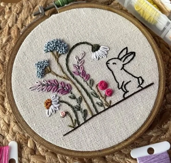 Bunny meadow hoop — mixed stitch garden scene on linen